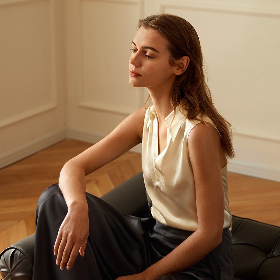 Woman wearing V-Neck Sleeveless Silk Shirt in cream color